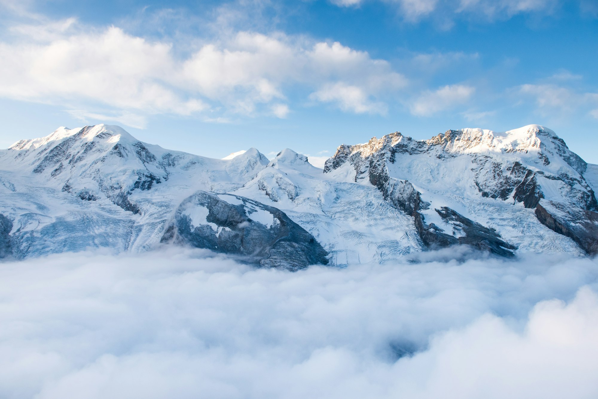 Swiss peaks above the clouds